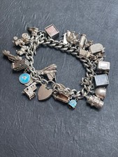 Huge vintage 1970s solid silver charm bracelet with 29 charms
