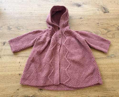 Hand knitted pink wool - hand,