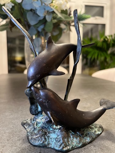 Two bronze metal dolphins - two,