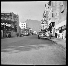 1950s HONG KONG KOWLOON CITY STREET SCENE CARS SIGNS LION ROCK ORIGINAL NEGATIVE