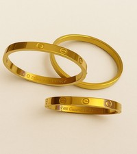 Gold-Tone Screw Bangle |