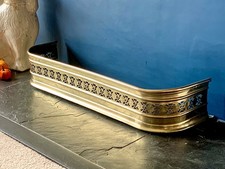 antique brass fire fender 68cm  x  20cm, hight 12.5 cm. Very clean condition.