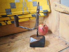 A fine 18th century wrought iron rushlight candleholder on wooden base