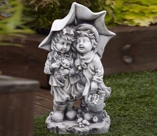 Stone children with umbrella