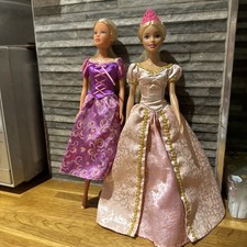 Barbie doll and simba doll