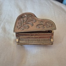 Small brass grand piano, Made