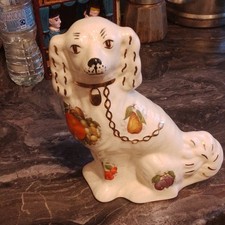 Sitting white ceramic DOG