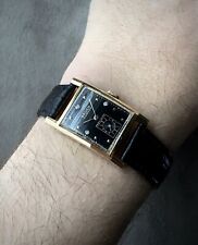 1940s Gruen Curvex Precision 14k gold cased watch with black diamond dial