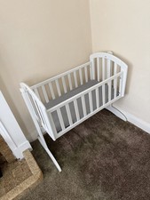 Baby swinging crib with mattress.