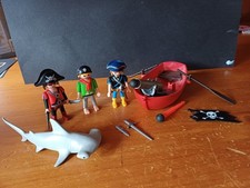 Playmobil pirates, shark, and
