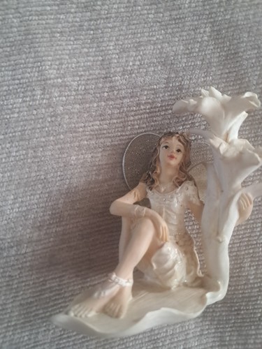 Fairy sitting next - fairy, to