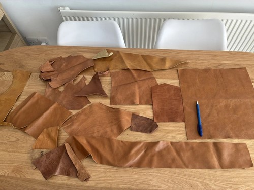 Tan and brown leather cowhide - and,
