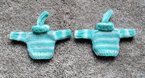 Hand knitted mini jumpers - hand,