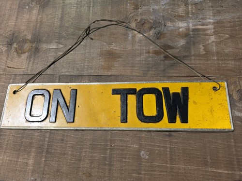 Vintage metal tow sign - on,