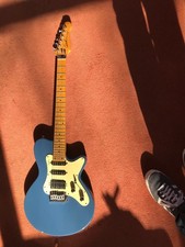 godin electric guitar with a