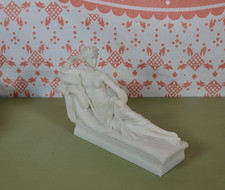 Vintage Ornament Figurine on a Chaise Longue
