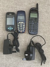 Three Old Mobile Phones, Two With Chargers.