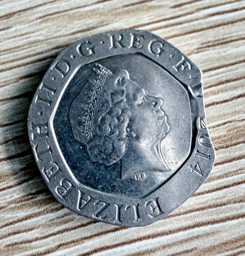 Clipped mint error - mint, 20p