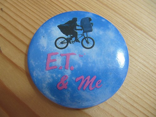 And vintage tin - e.t., badge