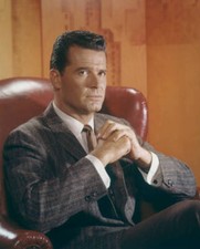 James Garner seated in red