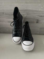 black glitter high-top Converse sneakers 