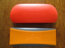 2 Glasses Cases. X-Eyes & Specsavers. Pre-owned. 15.2cm x 6cm x 2.3cm.