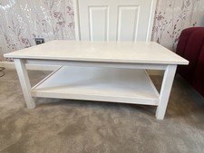 Large white wood Ikea coffee table with lower shelf. Needs sanding / repainting.
