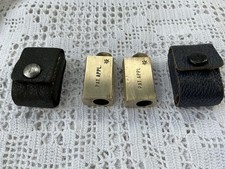 TWO ANTIQUE GERMAN PATENT BRASS ADJUSTABLE PENCIL SHARPENERS IN LEATHER CASES