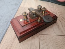 antique telegraph key on wooden base