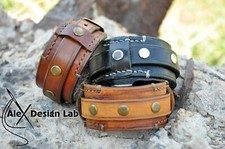 Worn brown studded Leather