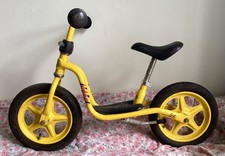 Puky child’s learner bike, yellow, used, but in good working order.