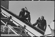 Workers removing refuse from