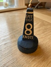 Nautical decorative lightweight wooden buoy in blue marked East Side 8 knots