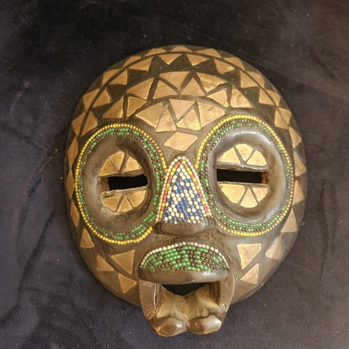 Hand carved gambian - hand‑carved,