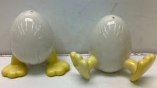 rare chicks hatching from cracked eggs feet showing salt & pepper shakers