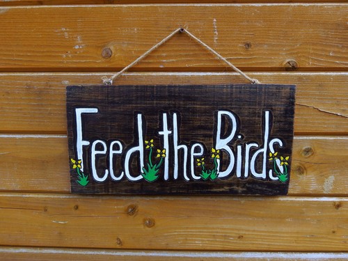 Feed the birds sign - birds", hand