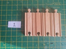 Various wooden train track pieces: straight, curved, splitters.