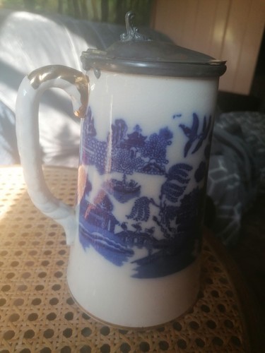 Antique ceramic jug featuring - ceramic,