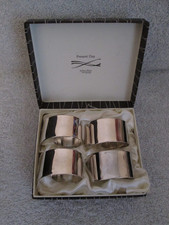 4 Swirl Napkin Rings Silver