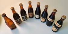 8 Miniature Guiness Bottles (7
