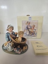 "Playing Mother " figurine by