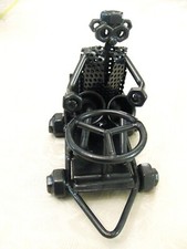 Steel figure hand crafted nuts & bolt sculpture