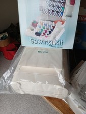 Portable sewing machine and sewing kit