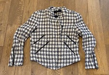 Zara Jacket in a cotton Dog-Toothed fabric, accented with Zip pockets and cuffs