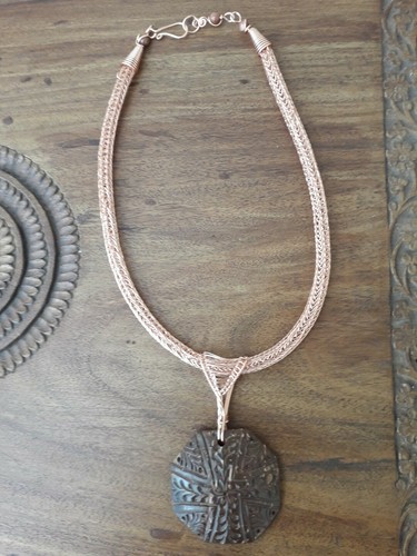 Carved coconut shell pendant
