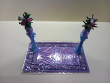 Purple rug, plinths, vases
