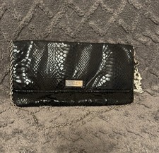 Stylish black clutch bag with