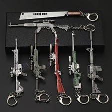 Gun Model Keychain Set of 7 – Mini Metal Weapons Keyring Gamer Gift Desk Decor