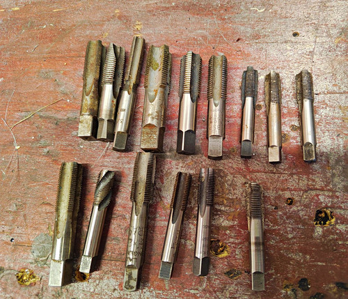 Machinists cutting taps - machinists,