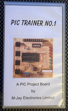 PIC Trainer Board with book and Microchip PIC16CF745-04/P